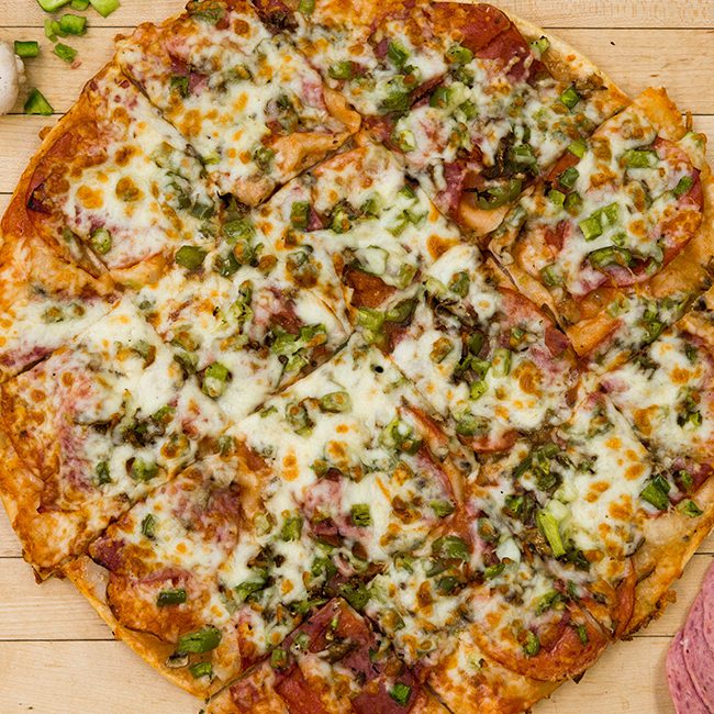 Finely crafted pizza for sports team fundraising, ready for delivery.